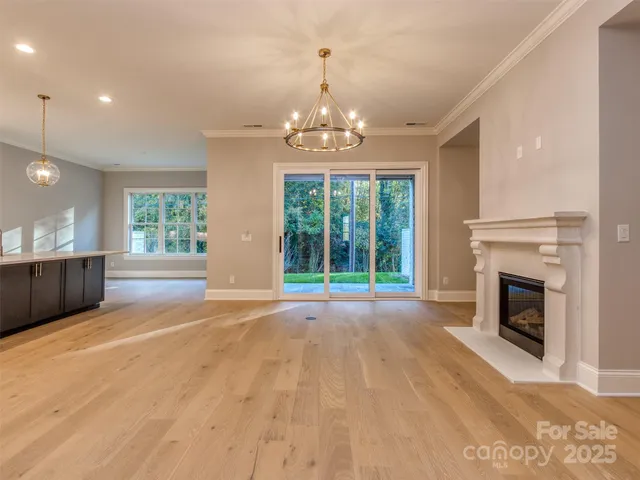 a view of livingroom with window fireplace and windows