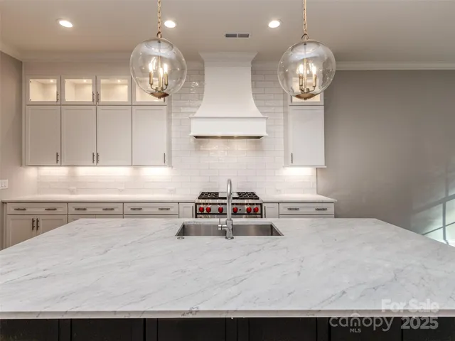 a kitchen with a stove and cabinets