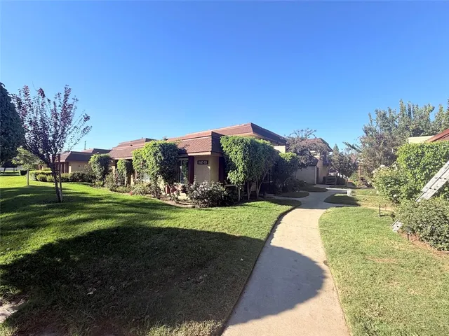 a view of a back yard of the house