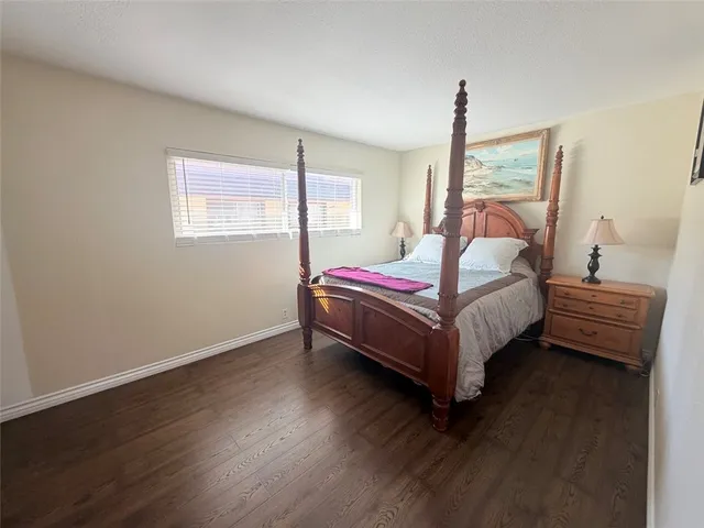 a bed room with a bed and a window