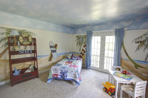 24145 West Milton Road Hawthorn Woods, IL 60047 - Photo 12 of 16 a bedroom with bed and a window