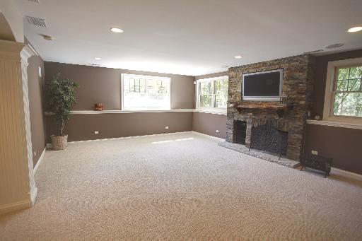 24145 West Milton Road Hawthorn Woods, IL 60047 - Photo 15 of 16 a living room with a window and a flat screen tv