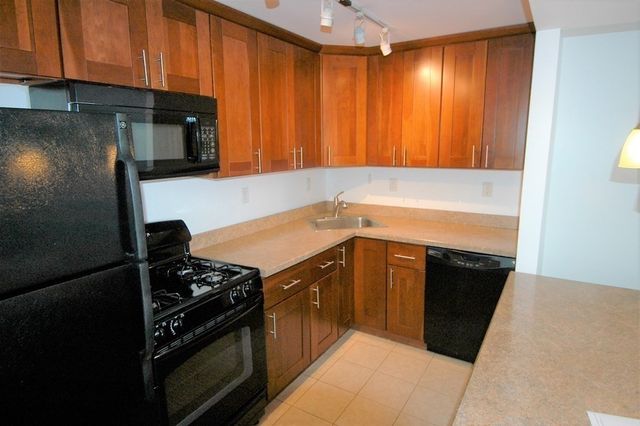 an empty room with large windows