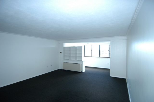 a kitchen with stainless steel appliances granite countertop a refrigerator a stove and a sink with wooden floor