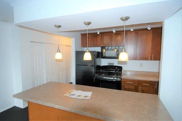 a kitchen with a stove and a microwave