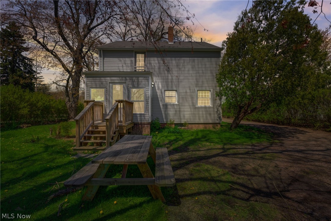 25819 Center Ridge Road Westlake, OH 44145 - Photo 36 of 45 Back house at dusk with a lawn