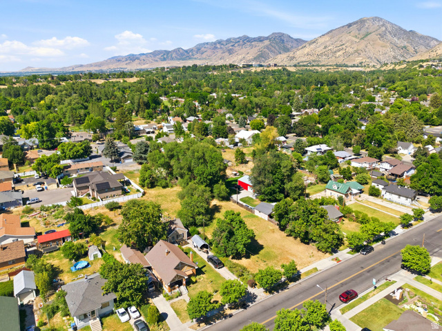 300 East S, Unit 2 Logan, UT 84321 - Photo 3 of 38 Expansive aerial perspective showcasing a residential neighborhood with varied architecture and mature trees