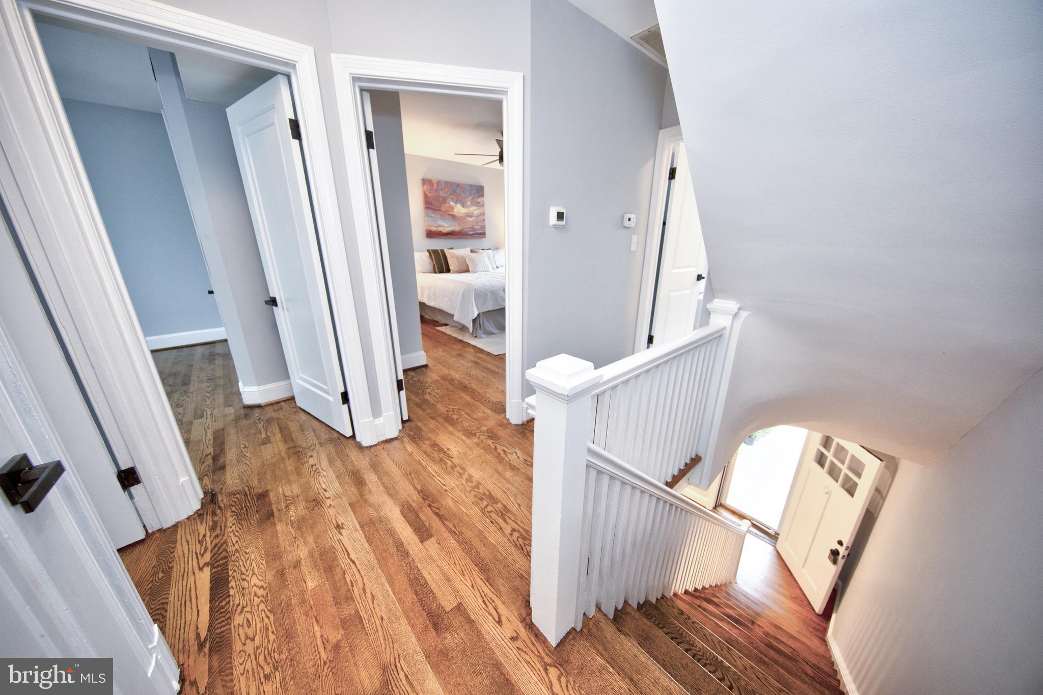 416 Dunkirk Road Baltimore, MD 21212 - Photo 13 of 33 a view of a livingroom with wooden floor and stairs