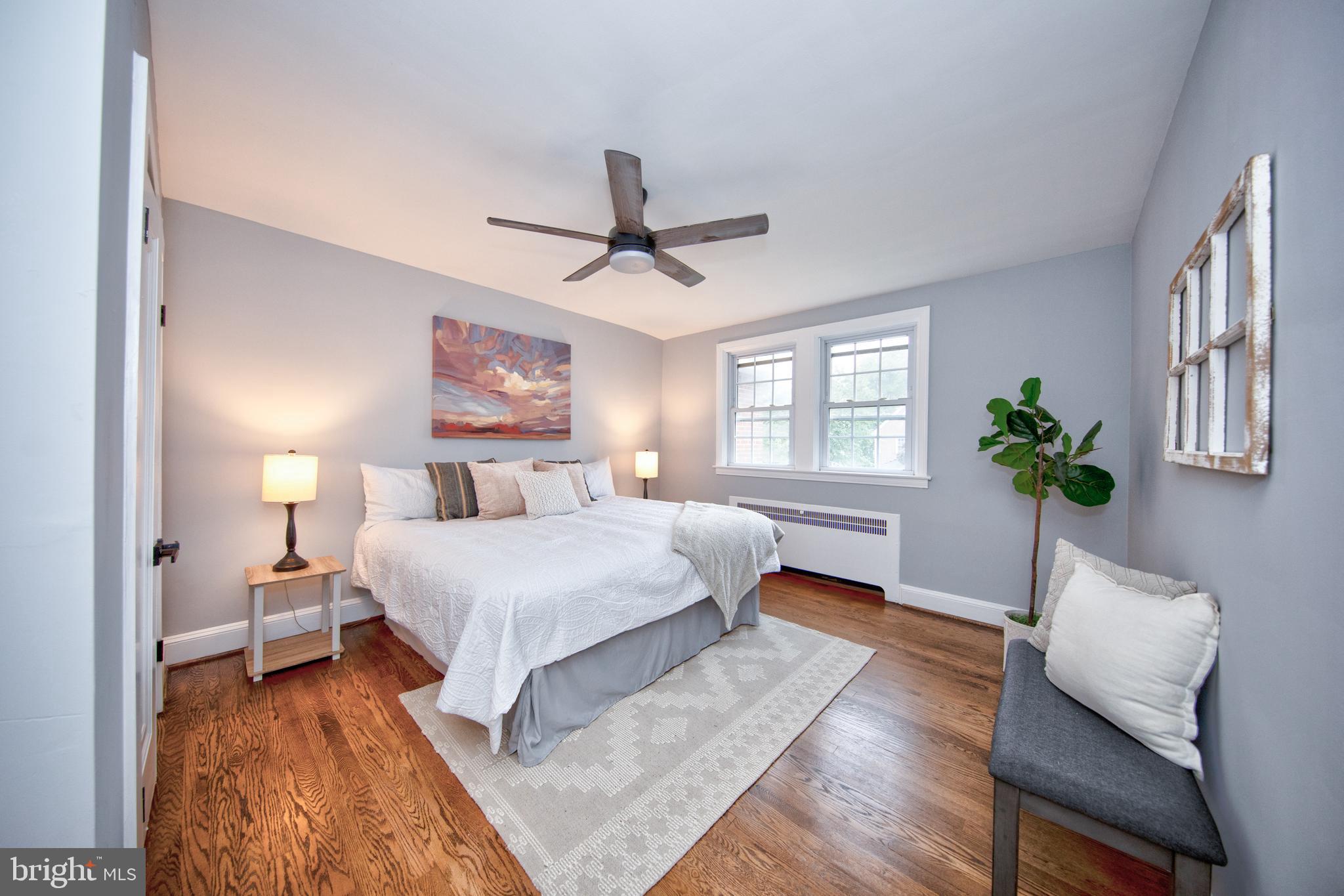 416 Dunkirk Road Baltimore, MD 21212 - Photo 16 of 33 a bedroom with a large bed chandelier and a window