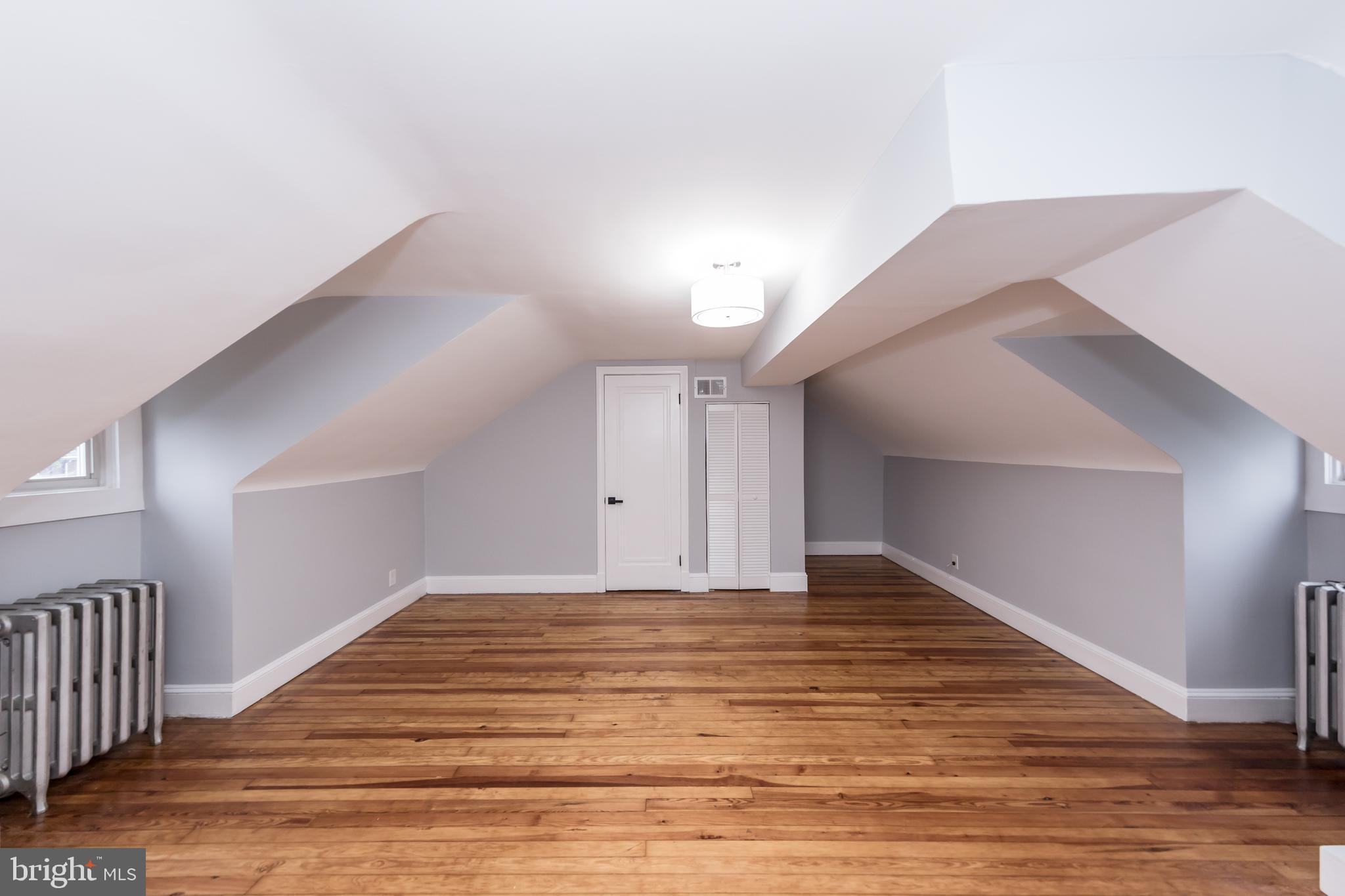 416 Dunkirk Road Baltimore, MD 21212 - Photo 22 of 33 a view of an empty room and wooden floor