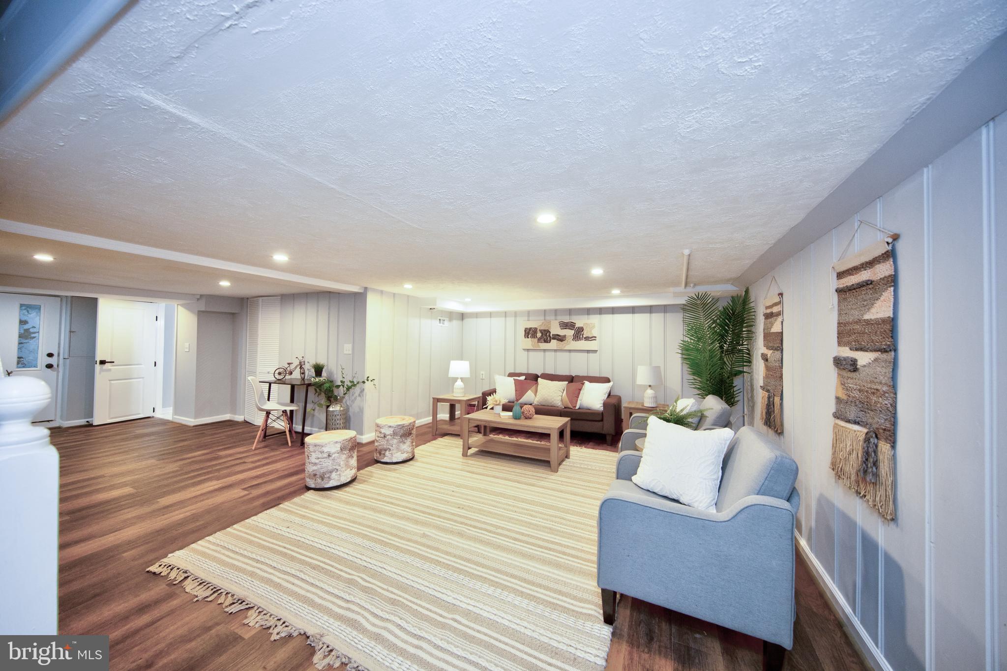 416 Dunkirk Road Baltimore, MD 21212 - Photo 25 of 33 a living room with furniture and a wooden floor