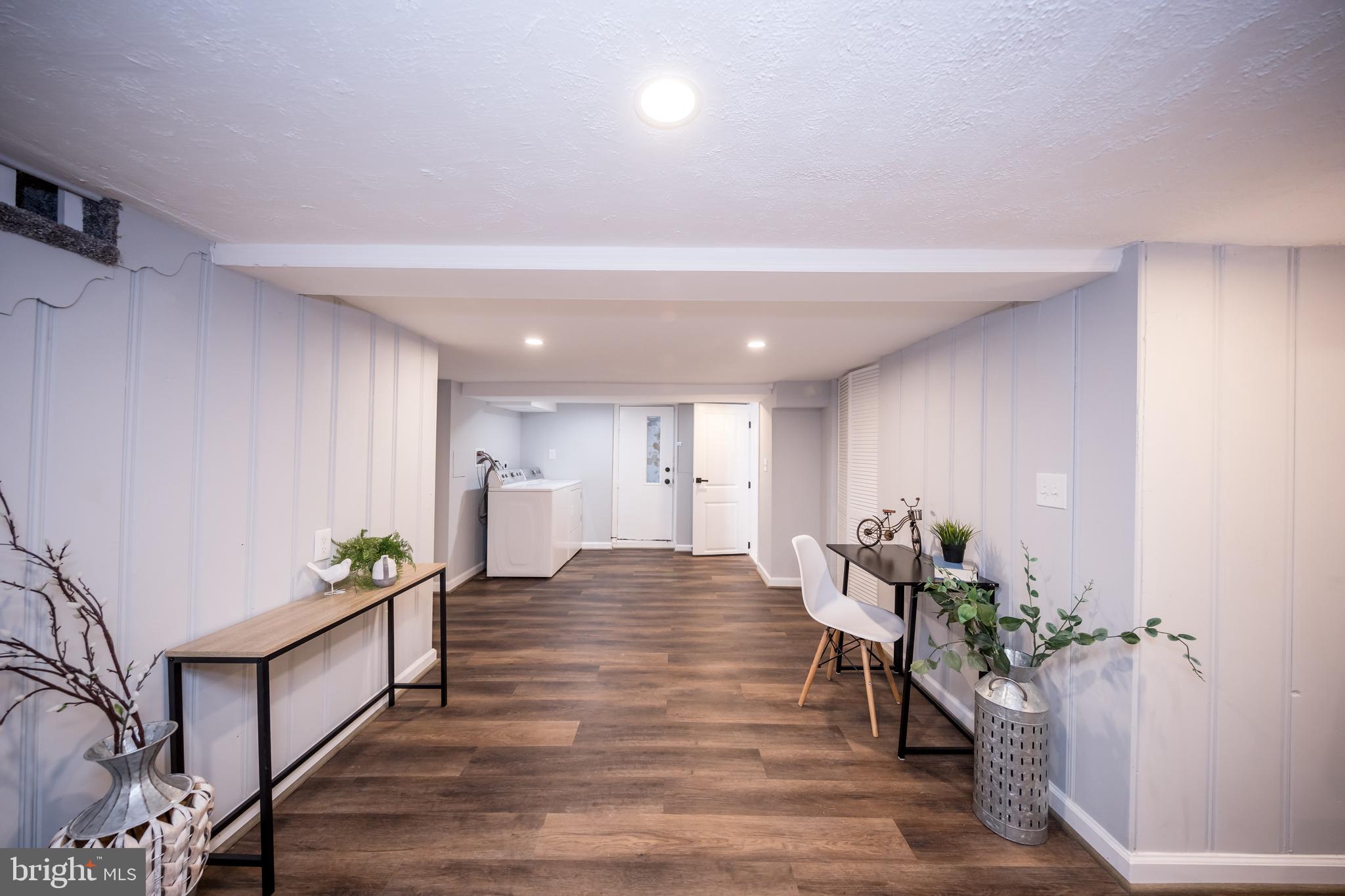 416 Dunkirk Road Baltimore, MD 21212 - Photo 29 of 33 a living room with furniture and wooden floor