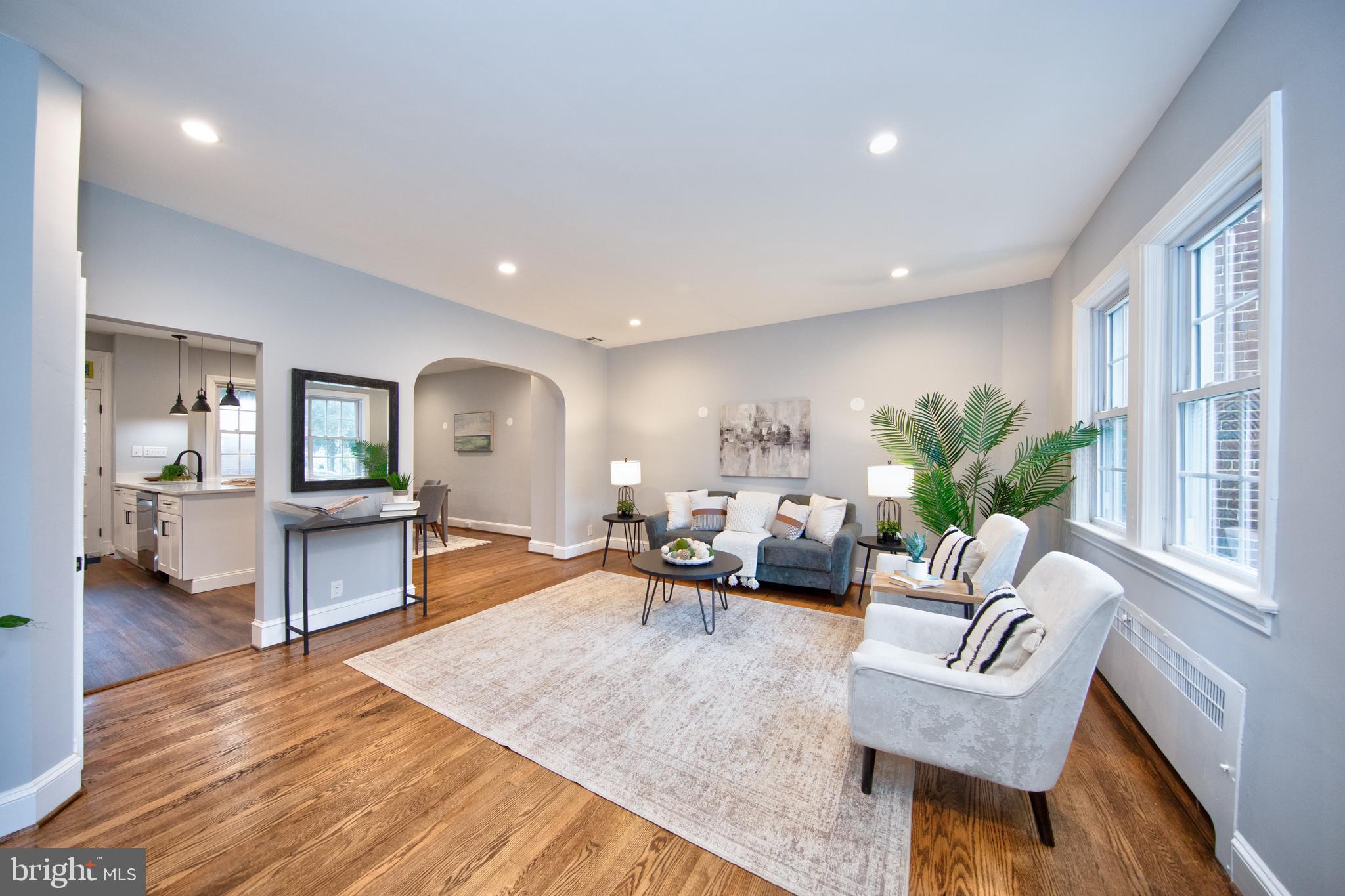 416 Dunkirk Road Baltimore, MD 21212 - Photo 4 of 33 a living room with fireplace furniture and a wooden floor