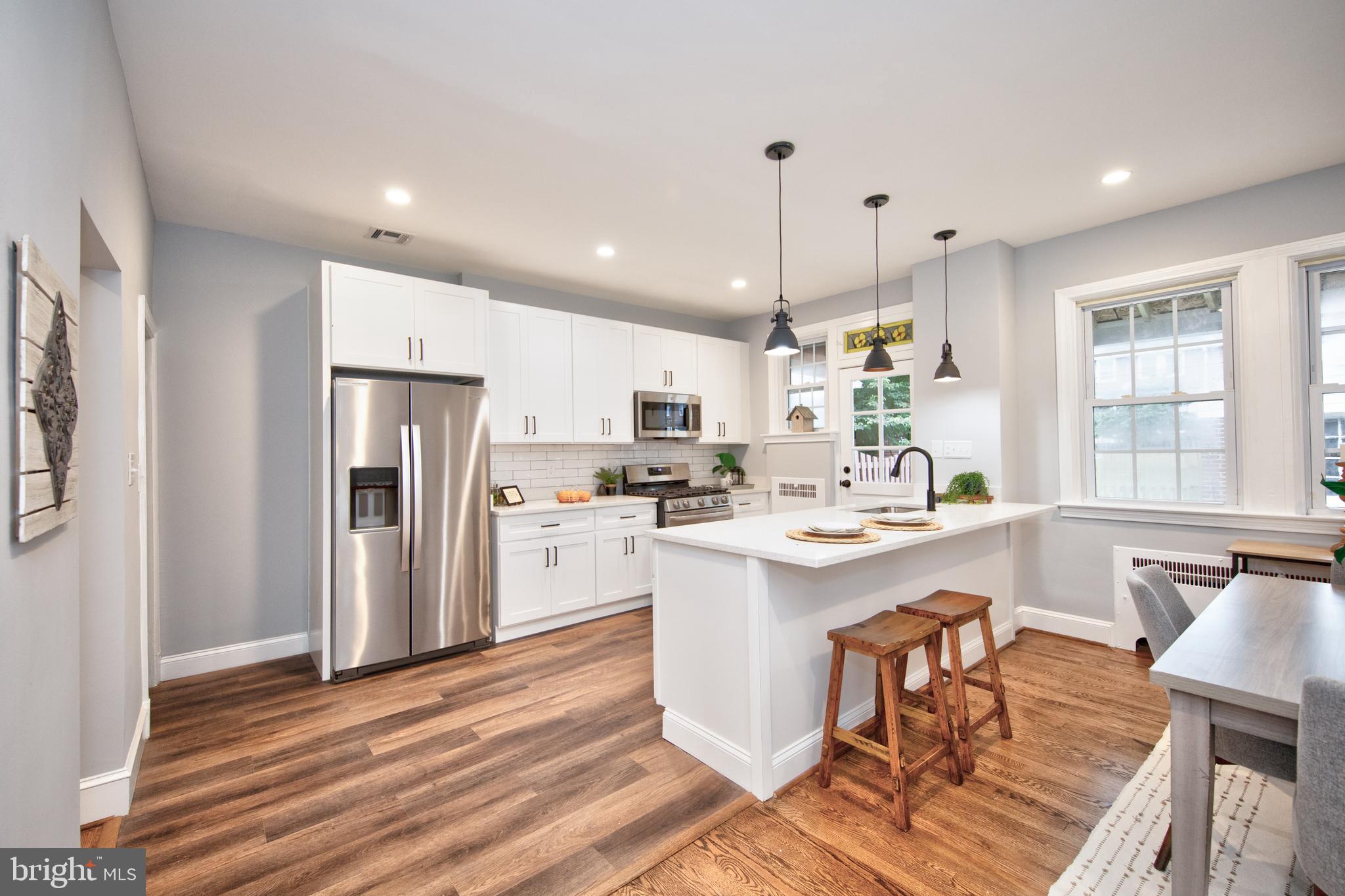 416 Dunkirk Road Baltimore, MD 21212 - Photo 9 of 33 a kitchen with refrigerator and cabinets