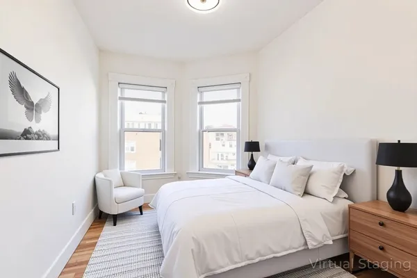 a bedroom with a bed and a couch