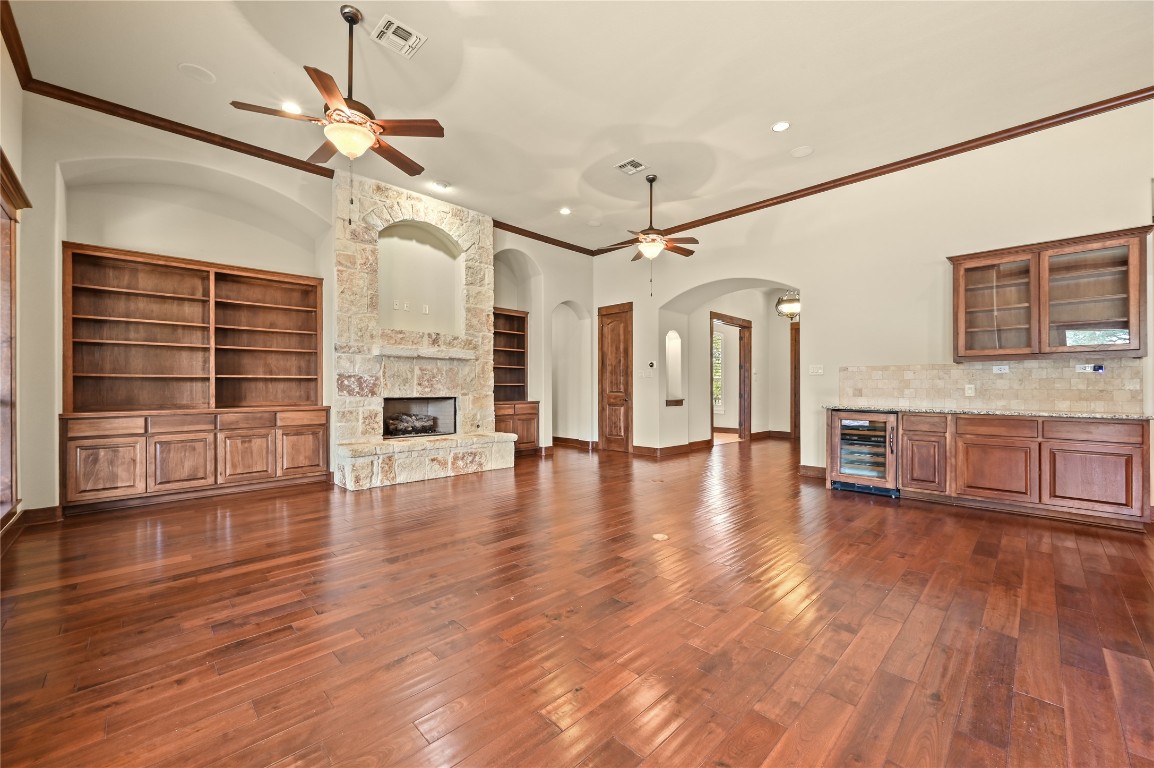 351 Hawthorne Loop Driftwood, TX 78619 - Photo 11 of 39 a view of a livingroom with furniture a ceiling fan and wooden floor