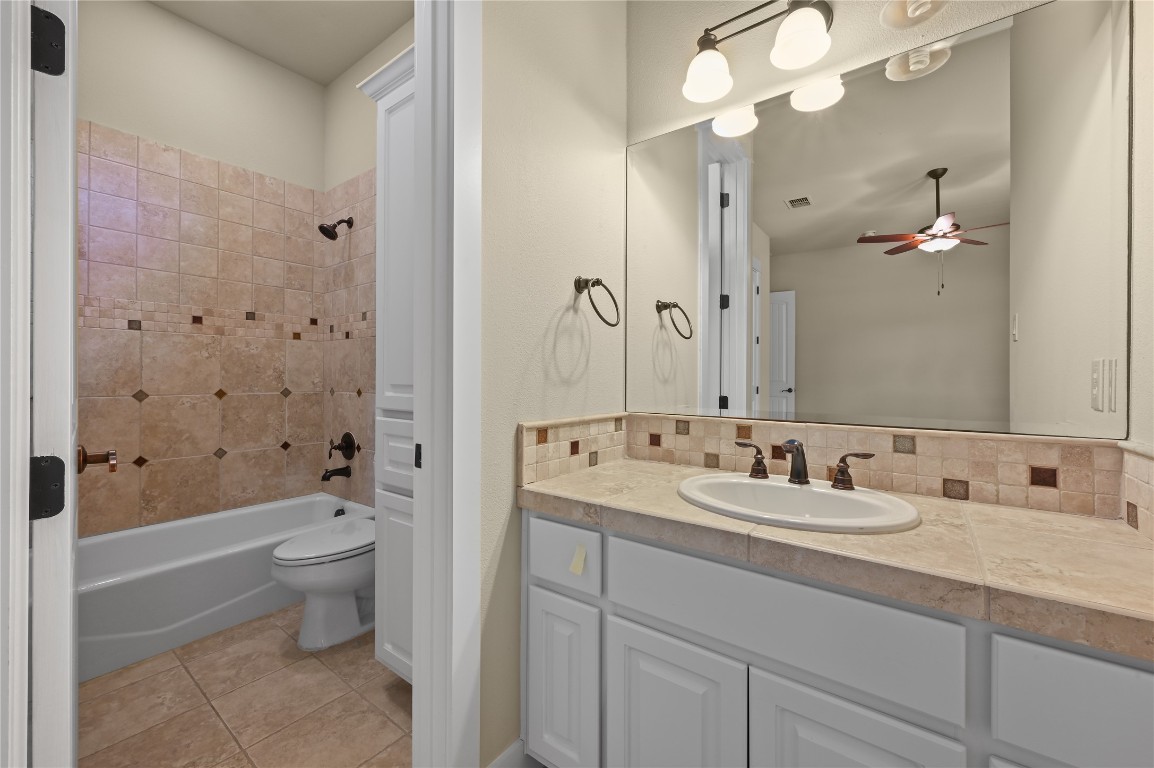 351 Hawthorne Loop Driftwood, TX 78619 - Photo 24 of 39 a bathroom with a double vanity sink mirror and toilet