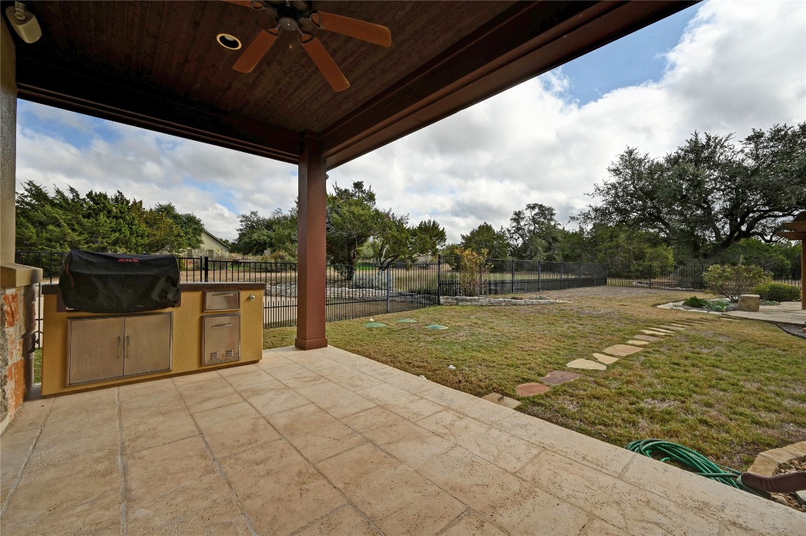 351 Hawthorne Loop Driftwood, TX 78619 - Photo 32 of 39 a view of backyard with large tree