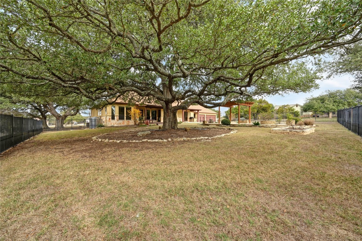 351 Hawthorne Loop Driftwood, TX 78619 - Photo 34 of 39 a view of road with large trees