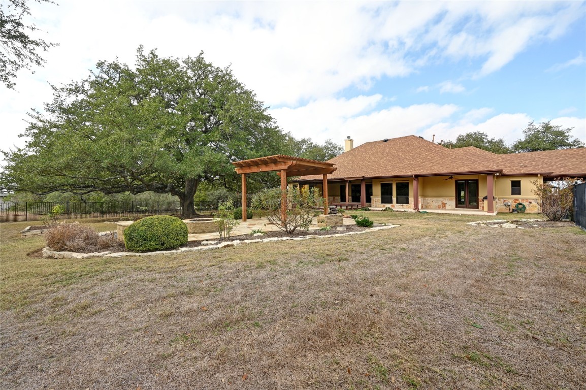 351 Hawthorne Loop Driftwood, TX 78619 - Photo 35 of 39 front view of a house with a patio
