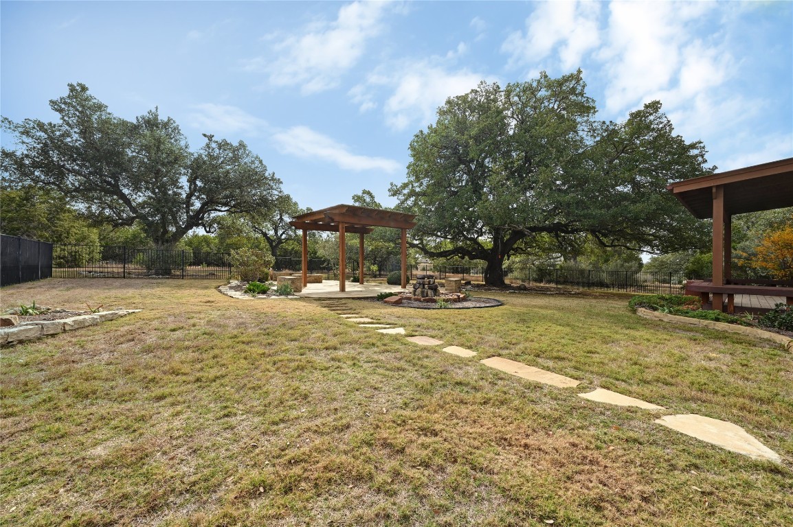 351 Hawthorne Loop Driftwood, TX 78619 - Photo 39 of 39 a view of yard with swimming pool and trees