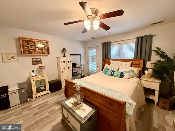 a bed room with a bed and a television