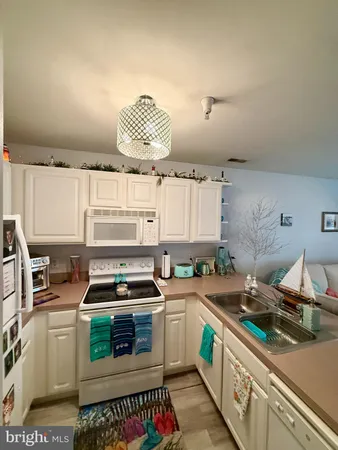a kitchen with a stove and a sink
