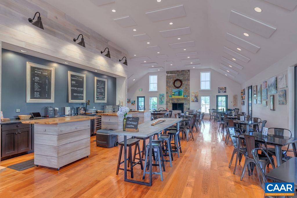 3304 A Ruritan Lake Road Palmyra, VA 22963 - Photo 13 of 37 a view of a dining area with furniture and wooden floor