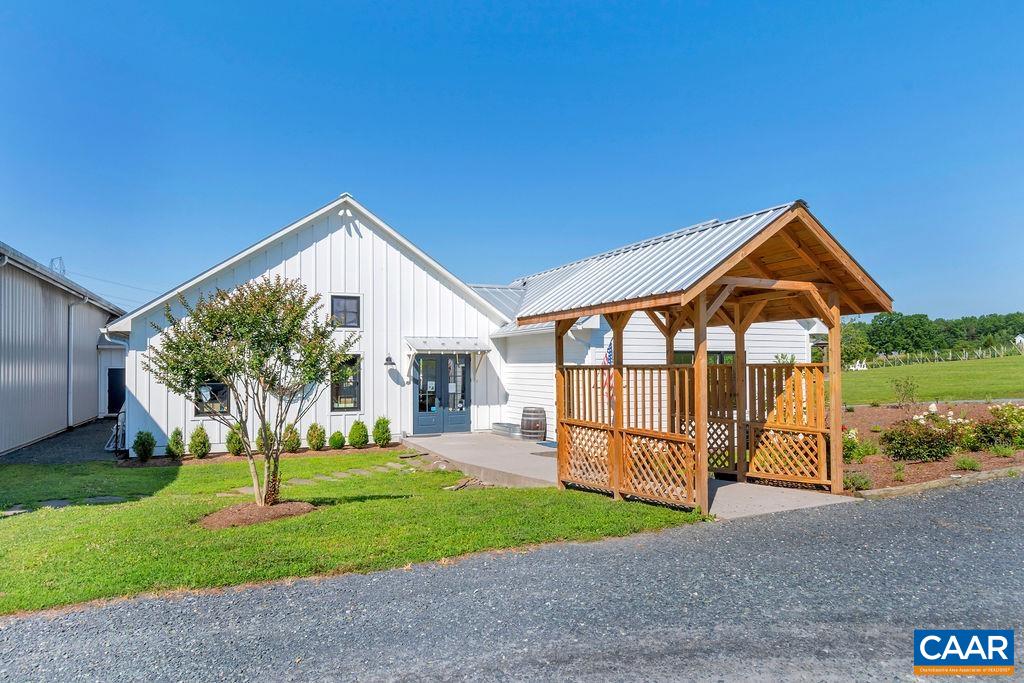 3304 A Ruritan Lake Road Palmyra, VA 22963 - Photo 33 of 37 a front view of a house with a yard and garage