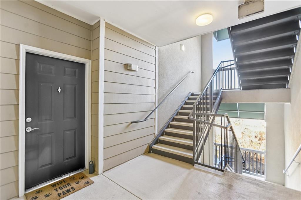 5641 Roswell Road, Unit 201 Atlanta, GA 30342 - Photo 13 of 14 a view of entryway with wooden floor and stairs
