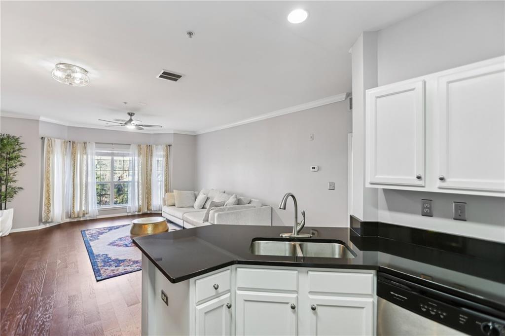 5641 Roswell Road, Unit 201 Atlanta, GA 30342 - Photo 6 of 14 a kitchen with a sink stove and cabinets