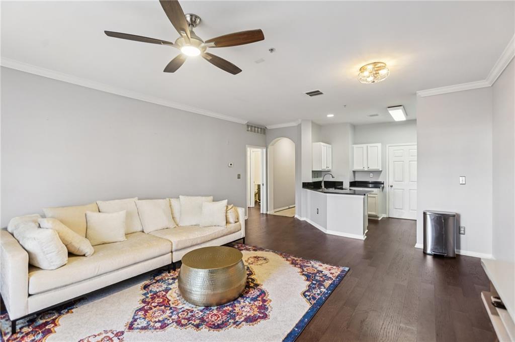 5641 Roswell Road, Unit 201 Atlanta, GA 30342 - Photo 7 of 14 a living room with furniture and kitchen view