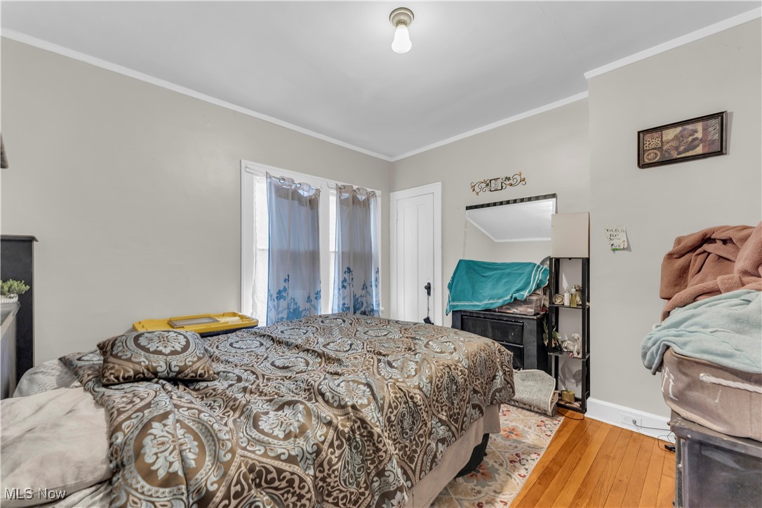 3406 Altamont Road Cleveland, OH 44118 - Photo 11 of 28 Bedroom with ornamental molding and hardwood / wood-style floors