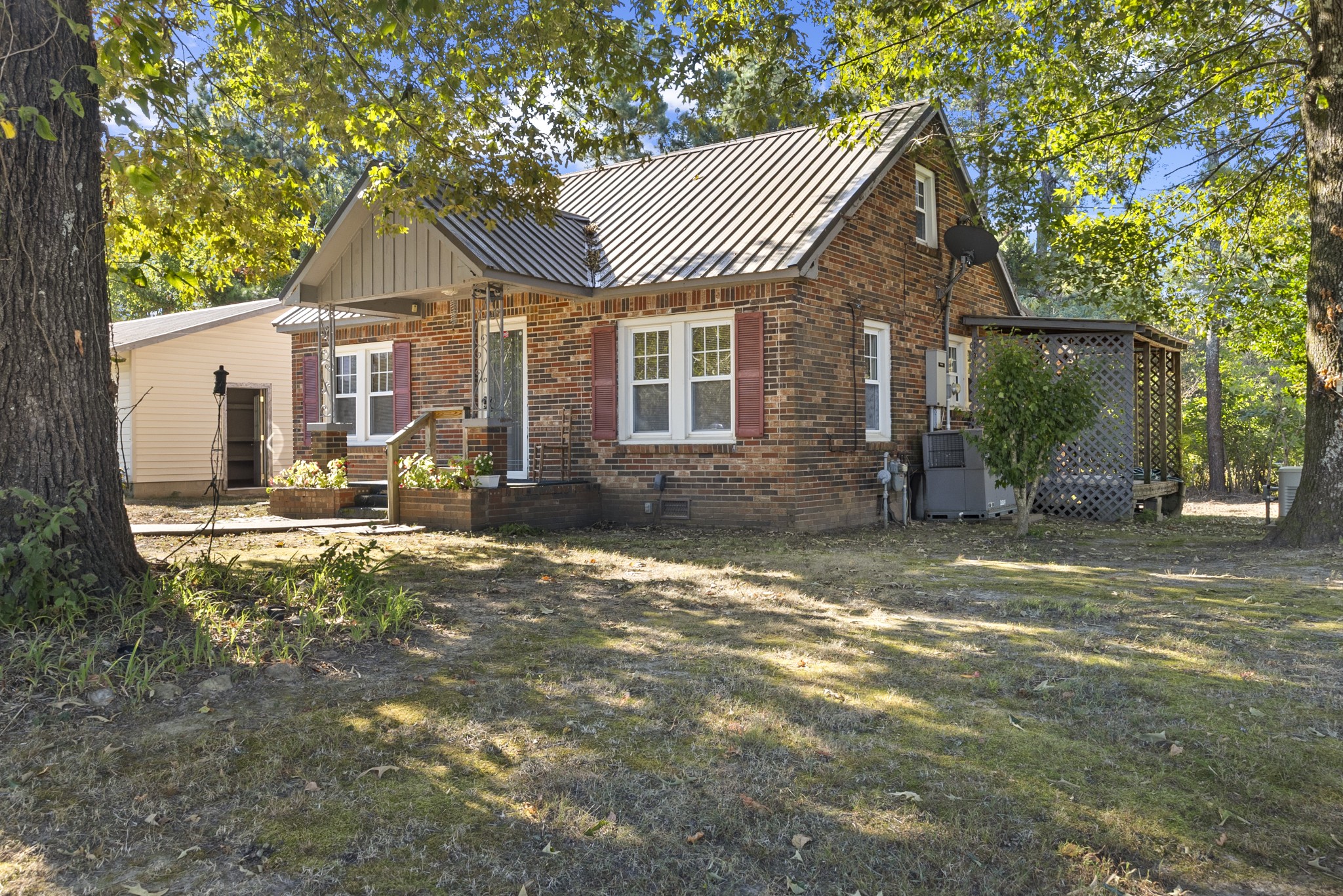 1210 Garton Road Burns, TN 37029 - Photo 19 of 32 a view of a house with a yard