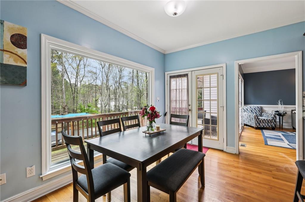 436 Lancelot Trail McDonough, GA 30252 - Photo 18 of 49 a view of a dining room with furniture window and wooden floor