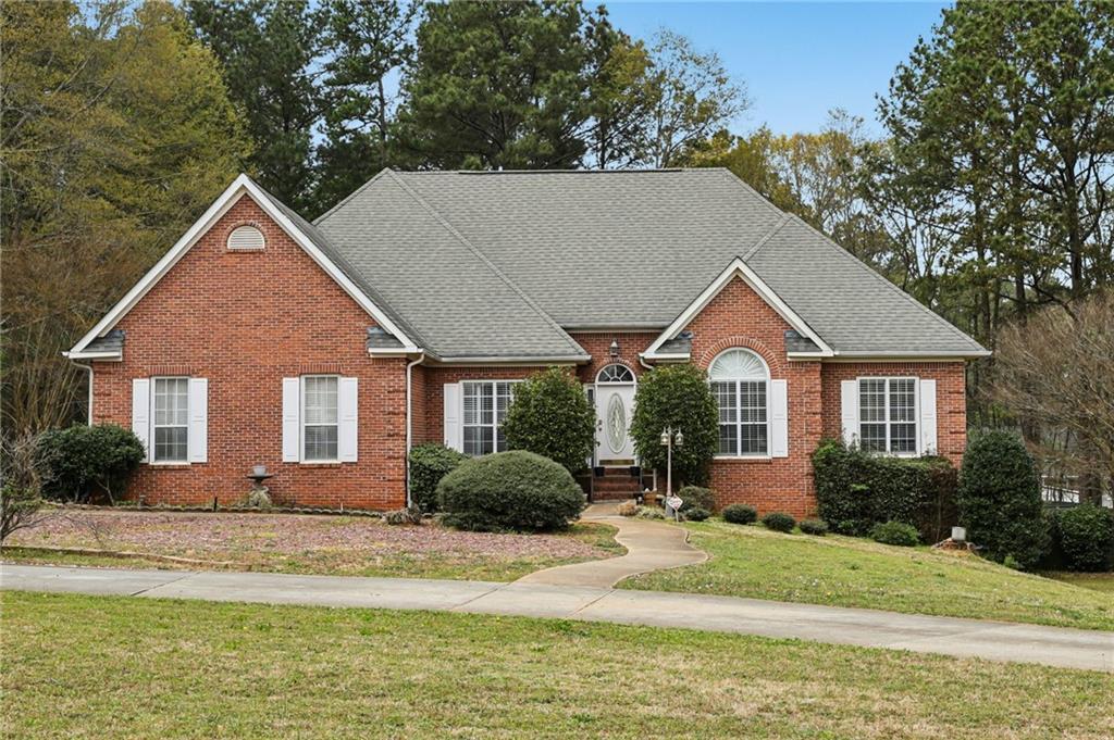 436 Lancelot Trail McDonough, GA 30252 - Photo 2 of 49 a front view of a house with a yard