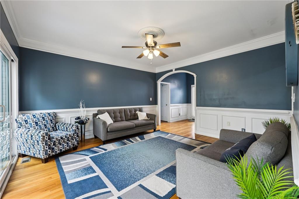 436 Lancelot Trail McDonough, GA 30252 - Photo 25 of 49 a living room with furniture and a chandelier