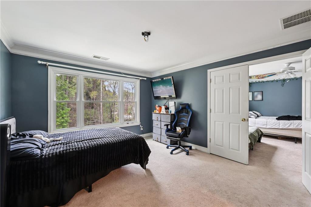 436 Lancelot Trail McDonough, GA 30252 - Photo 29 of 49 a bed room with a bed and a chair