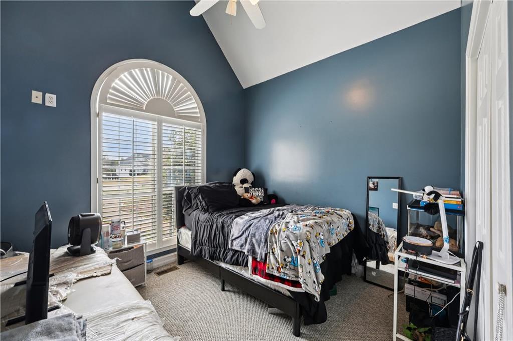 436 Lancelot Trail McDonough, GA 30252 - Photo 33 of 49 a bedroom with a bed and a window
