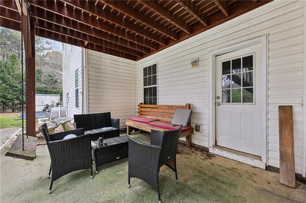 436 Lancelot Trail McDonough, GA 30252 - Photo 43 of 49 a backyard of a house with table and chairs