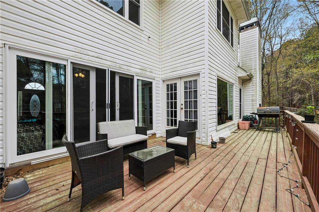 436 Lancelot Trail McDonough, GA 30252 - Photo 49 of 49 a balcony with wooden floor and furniture
