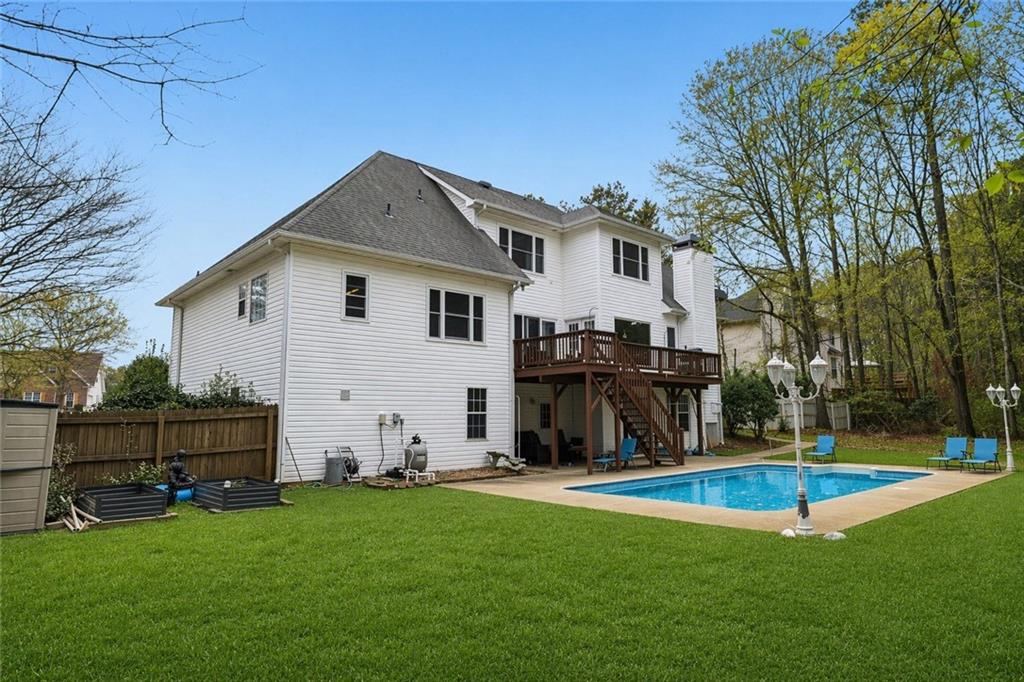 436 Lancelot Trail McDonough, GA 30252 - Photo 5 of 49 a view of a house with backyard and a tree