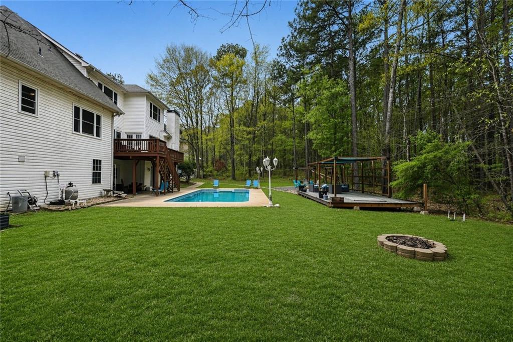 436 Lancelot Trail McDonough, GA 30252 - Photo 7 of 49 a view of a house with a backyard