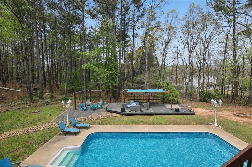 436 Lancelot Trail McDonough, GA 30252 - Photo 9 of 49 a view of a swimming pool with a patio