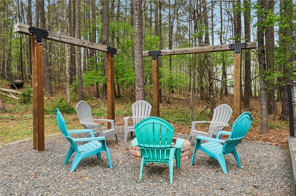 436 Lancelot Trail McDonough, GA 30252 - Photo 10 of 49 a view of a chair and tables in the backyard