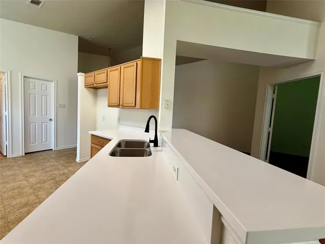 a bedroom with a bed and a large mirror