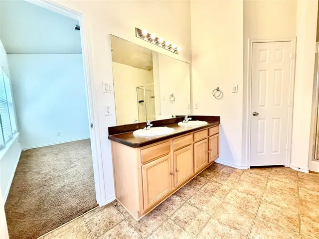 a kitchen that has a sink and a stove