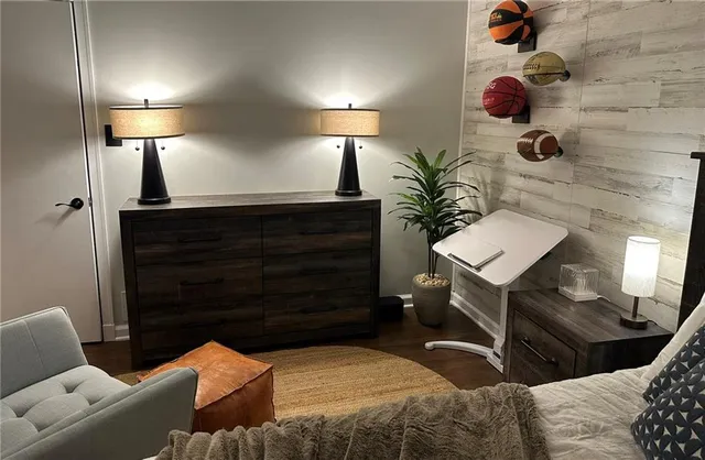 a living room with furniture and a lamp