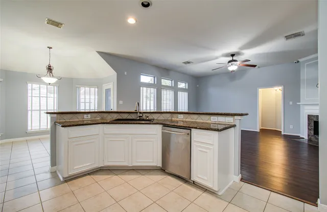 a view of an empty room with windows