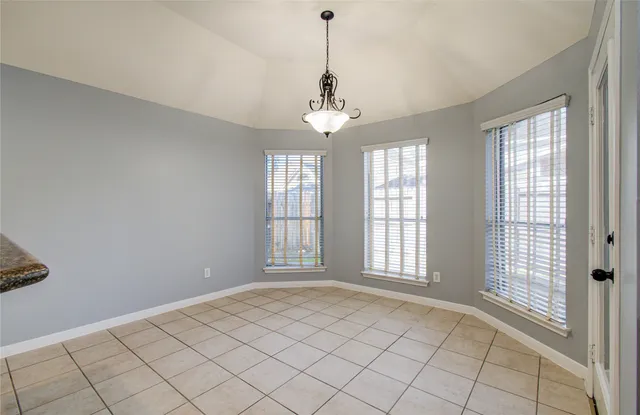 a kitchen with a counter space a sink appliances and cabinets